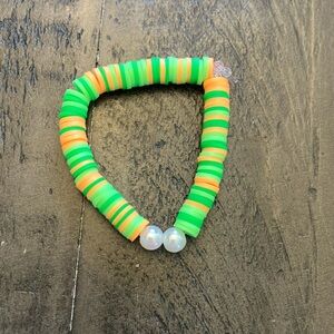 Green and orange clay beaded bracelet